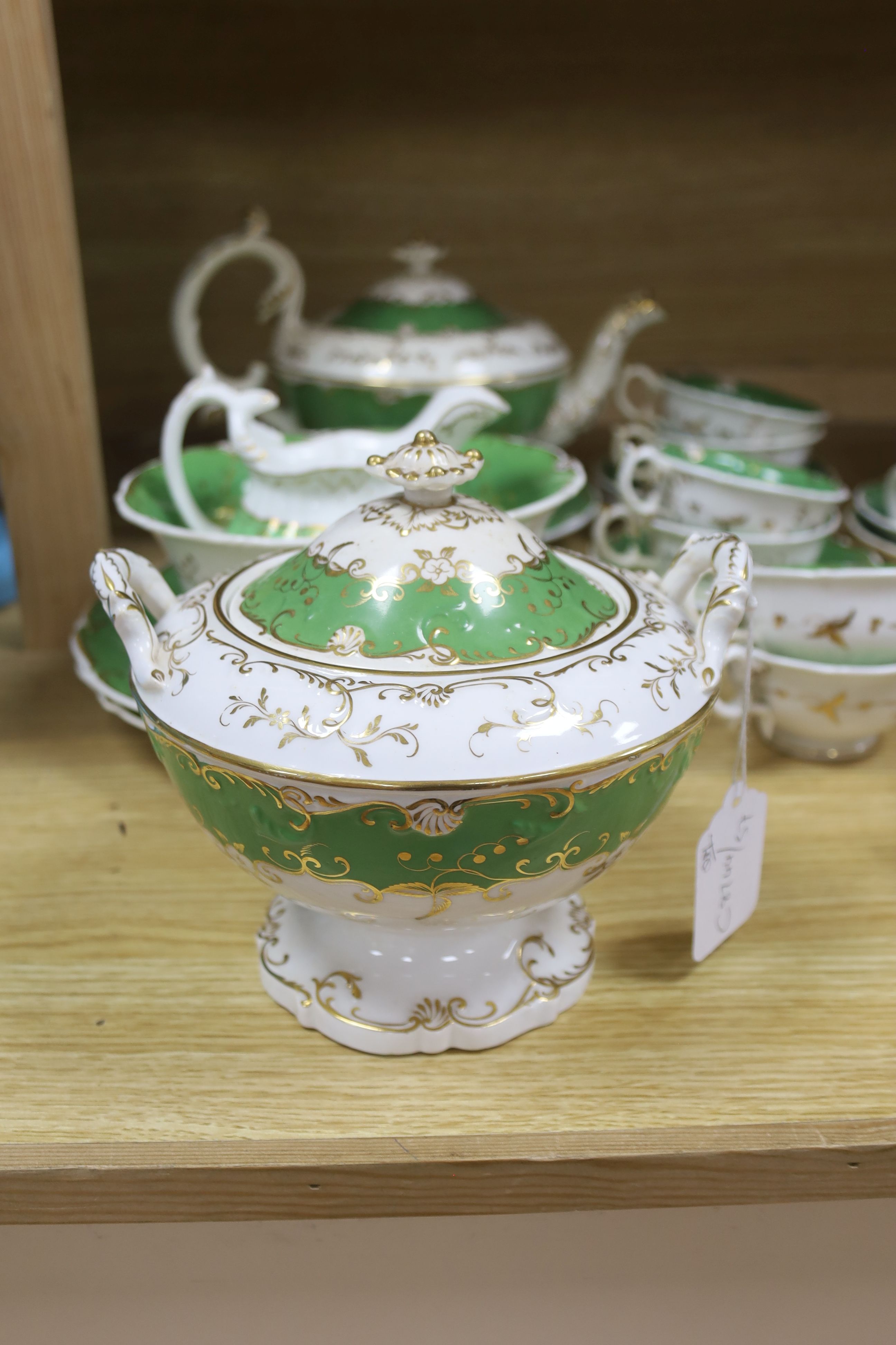 A Copeland blue and white nine cup and saucer cabaret set on stand and a 19th century Rockingham style green and gilt decorated tea ser